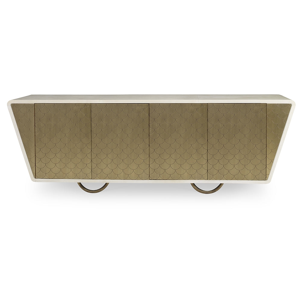 The Julian Chichester Danish Fishscale Cabinet is a modern sideboard with a beige textured front in a fishscale pattern, featuring a sloped design and circular metal legs wrapped in brass.