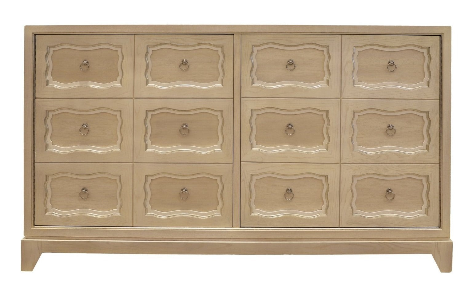The Dorothy Door Chest by Kindel is a cerused white wooden dresser with a light finish, featuring three rows of six drawers adorned with decorative carved borders and brass ring pulls, offering a touch of Dorothy Draper elegance.