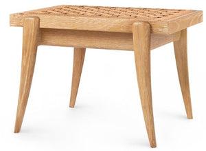 Introducing the Dylan Stool by Villa & House: a beautifully crafted wooden piece with a handwoven seagrass top and elegantly angled legs, inspired by African art traditions.