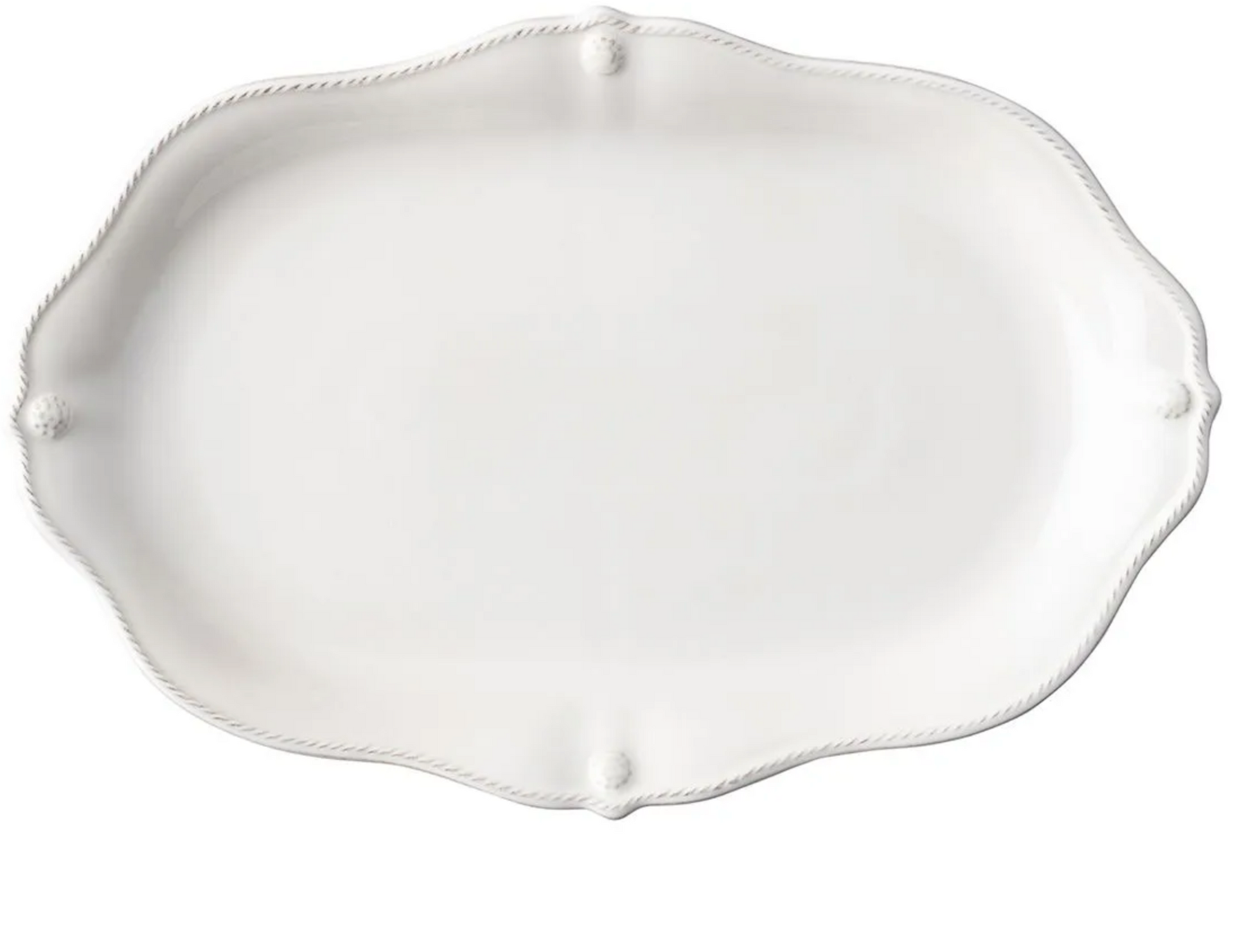 The Juliska Berry & Thread Whitewash 16" Platter features an oval ceramic shape with a scalloped edge and subtle detailing, perfect for enhancing your dinnerware collection.