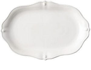 The Juliska Berry & Thread Whitewash 16" Platter features an oval ceramic shape with a scalloped edge and subtle detailing, perfect for enhancing your dinnerware collection.