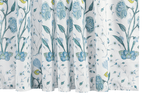 Matouk Khilana Shower Curtain from the Matouk Schumacher collection, featuring a floral pattern in shades of blue with detailed flowers and leaves, partially drawn back.