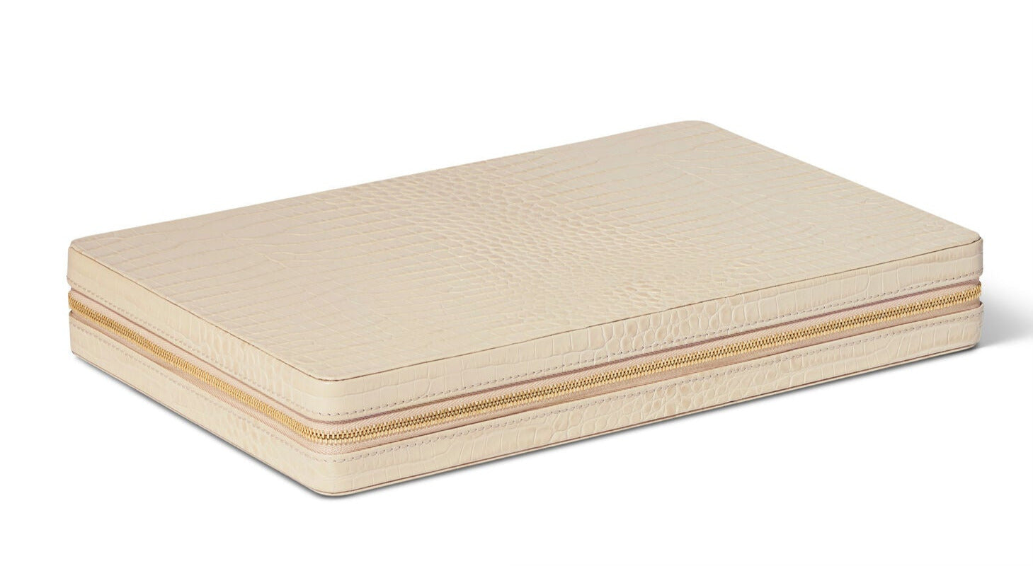 The Aerin Enzo Backgammon Travel Set in Fawn, featuring a rectangular croc-embossed Italian leather exterior, is shown closed on a white background.