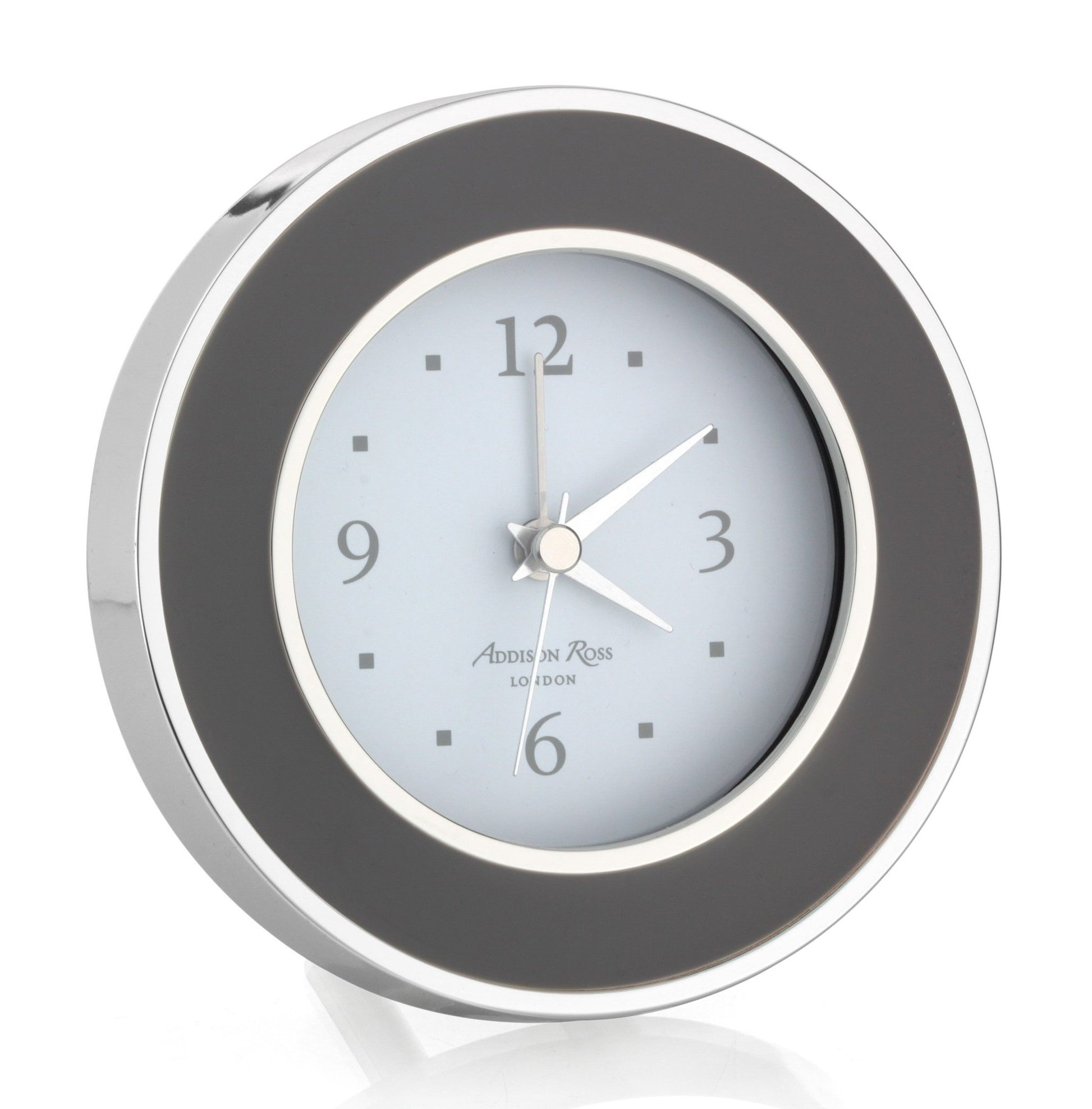 The Round Silver Alarm Clock by Addison Ross features a silver and black analog design—an elegant choice for your bedside table.
