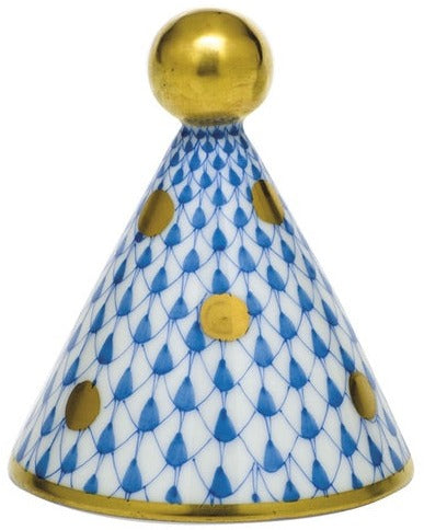 The Herend Party Hat features a cone shape with a gold ball top, hand-painted blue fish scale pattern, gold dots, and a gold-rimmed base—an exquisite porcelain piece for art lovers.