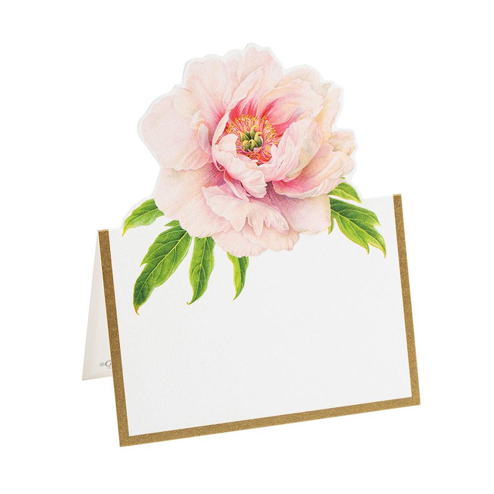 The Caspari Blush Die-Cut Place Card is a tent-style card made from sturdy cardstock, featuring a gold border and a large pink peony with green leaves at the top.