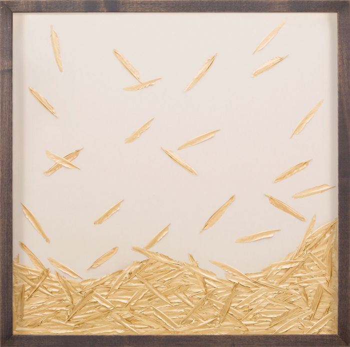 Natural Curiosities' Golden Feathers artwork features scattered beige and gold feathers, with a luxurious layer of overlapping feathers at the bottom against a cream background in a Space Shadowbox frame, creating a stunning piece.