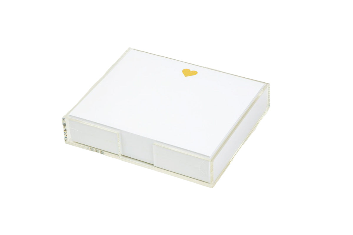 The Black Ink Heart Large Notepad features a stack of smooth white cardstock in a clear Lucite holder, with the first sheet adorned by a luxe gold foil heart.