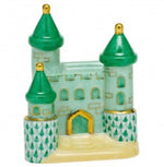 The Herend Castle by Herend is a small decorative ceramic castle with green roofs, gold accents, and patterned lower towers, featuring hand-painted designs for artistic appeal.