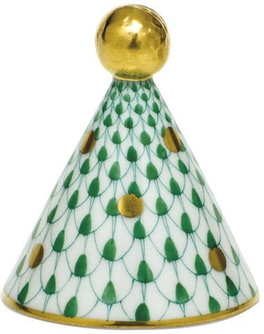 The Herend Party Hat is a porcelain cone with a gold ball on top, hand-painted in a green scale pattern with gold dots, and finished with gold trim at the base and top.