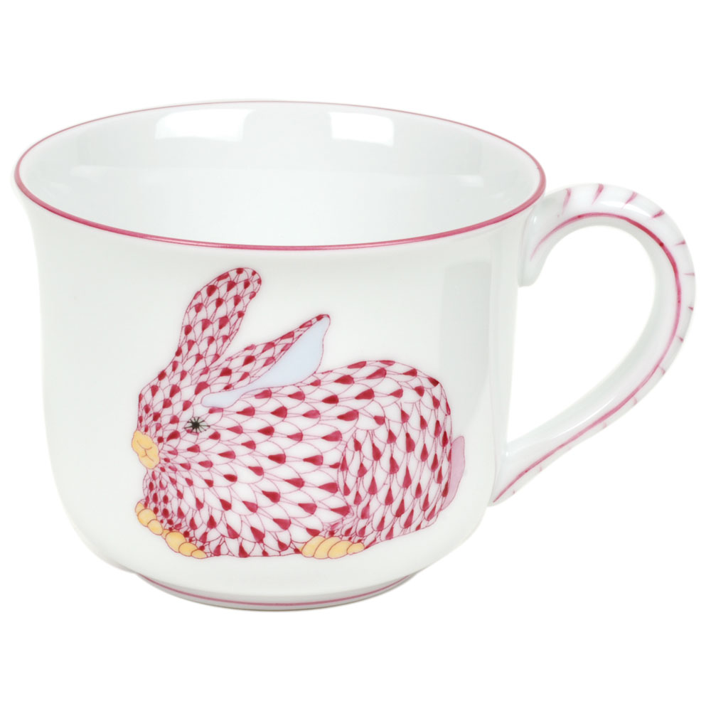 A Herend Bunny Mug, Pink with a red bunny on it.