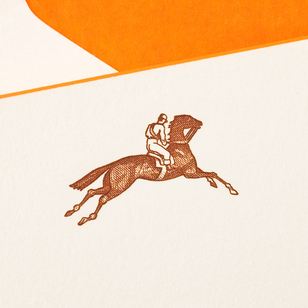 Printery's Equestrian Card Set features a brown line drawing of a jockey on a galloping horse, printed on white paper with an orange accent—ideal for sending unique greetings.