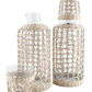 The Be Home Seagrass Cage Carafe features clear glass wrapped in beautiful seagrass. Handwash is recommended to maintain its natural charm.