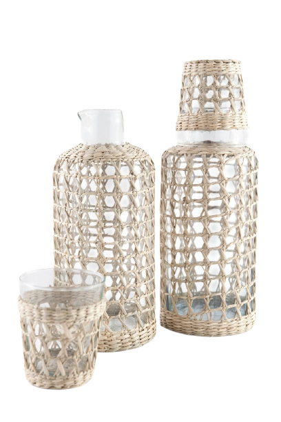 The Be Home Seagrass Cage Carafe features clear glass wrapped in beautiful seagrass. Handwash is recommended to maintain its natural charm.