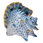 A Herend Medium Conch Shell, Blue porcelain shell on a white background.