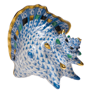 Herend’s Medium Conch Shell, Blue, is a porcelain figurine adorned with blue and white fishnet pattern, gold edging, and hand-painted green and black accents.