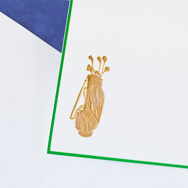 The Printery Golf Bag Card Set features a bright white horizontal card with a bronze golf bag and clubs, green border, atop a white envelope with dark blue tissue peeking from the corner.