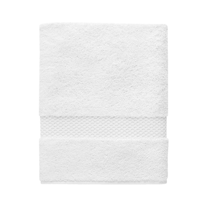 The Etoile Blanc Bath Towel by Yves Delorme is crafted from a luxurious cotton blend, features a textured band at one edge, and is shown neatly folded on a plain white background.