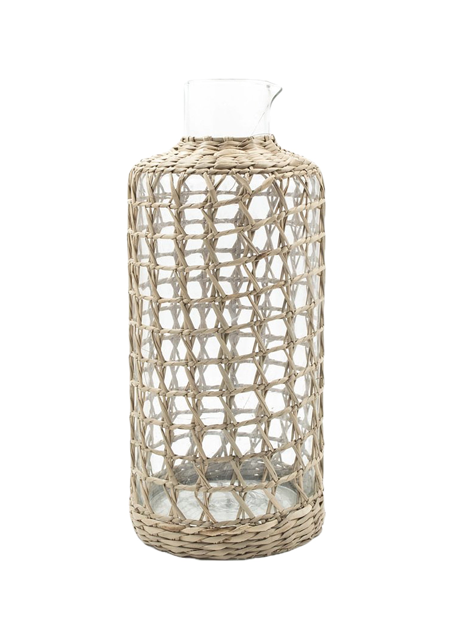 The Be Home Seagrass Cage Carafe features a clear cylindrical design with seagrass wrapping, a small spout, and an open top. Handwash is recommended to preserve its beauty.