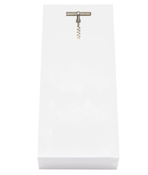 A vintage corkscrew is displayed on a white rectangular pedestal, paired with a stylish Black Ink Skinny Notepad Holder.