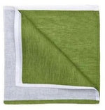 The Deborah Rhodes Resort Two-Tone Napkin Set features folded green linen napkins with white borders, shown partly unfolded to reveal both sides—ideal for bringing vibrant color to your summer table.