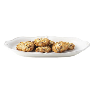 The Juliska Berry & Thread Whitewash 16" Platter elegantly displays six oat and chocolate chip cookies, serving as a refined piece of dinnerware.
