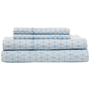 The John Robshaw Kama Bedding Collection features cool, crisp organic percale cotton bed sheets with a light blue circular pattern on white, neatly folded and including two flat sheets and two pillowcases.