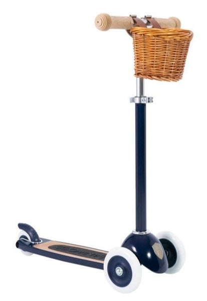 Banwood Scooter with an Easy Ride Steering System and a wicker basket mounted on the handlebars.