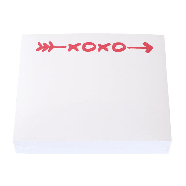 A Black Ink XOXO Large Notepad with the word "xoxo" written on it, enclosed in an elegant Lucite Notepad Holder.