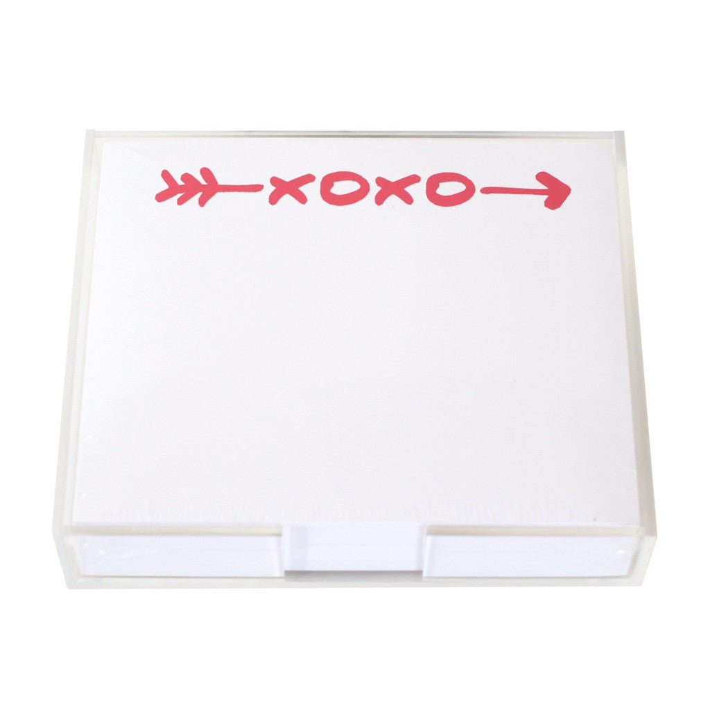 The XOXO Large Notepad by Black Ink features a clear Lucite holder and quality paper. The top sheet displays a bold red "XOXO" and a red arrow across the top.