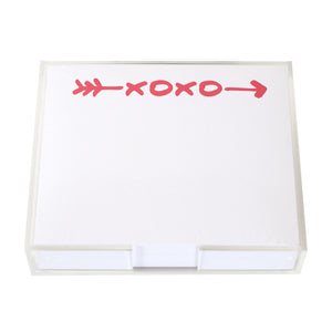 The XOXO Large Notepad by Black Ink features a clear Lucite holder and quality paper. The top sheet displays a bold red "XOXO" and a red arrow across the top.
