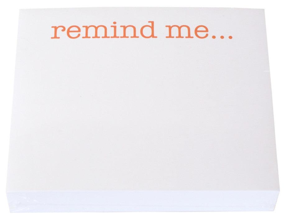The Remind Me Large Notepad by Black Ink features "remind me..." in orange atop high-quality white paper, ideal for use with any Lucite Notepad Holder.