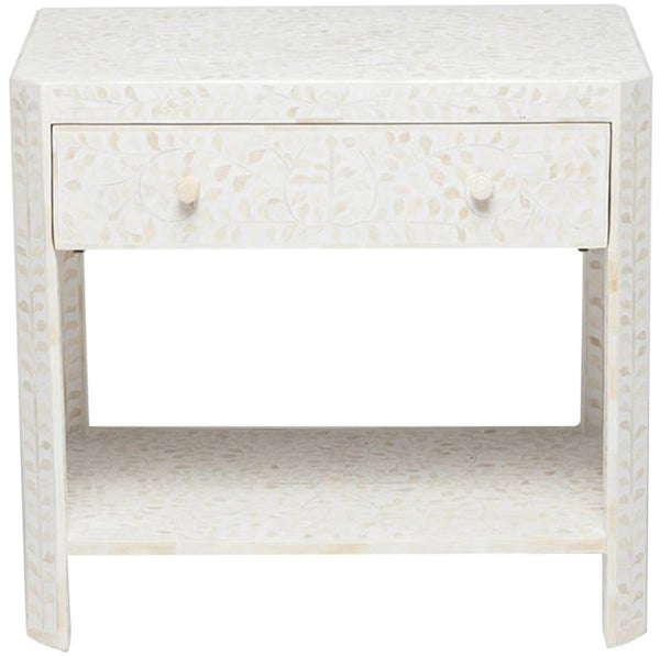 The Lexi White Floral Bone Side Table by Made Goods is a nightstand distinguished by its single drawer and lower shelf, adorned with an intricate Indian pattern design.