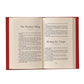 The open book, featuring a red cover like Harvey Penick’s Little Red Book by Graphic Image, displays pages 94 and 95. Titles such as "The Prettiest Swing" and "Hitting the Target" are visible, appealing to golf enthusiasts.