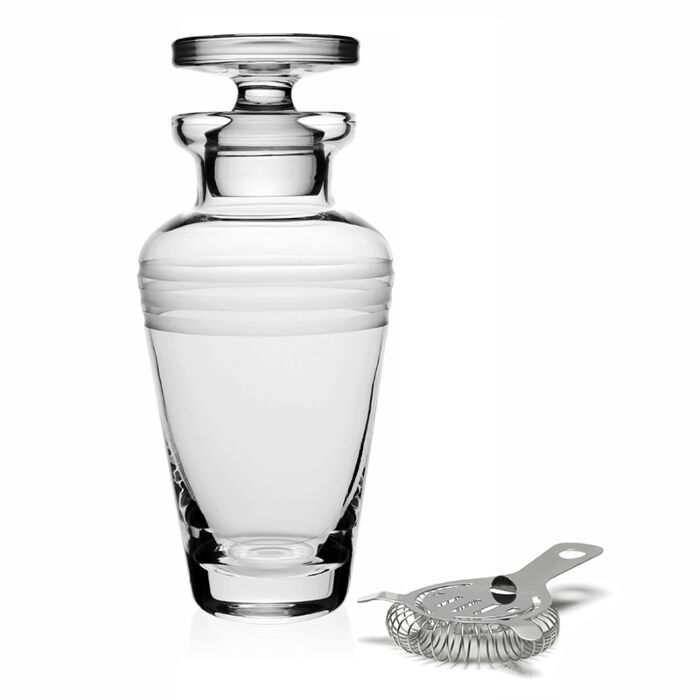 The Madison Cocktail Shaker with Strainer by William Yeoward Crystal features handmade glass with copper-wheel engraved details, paired perfectly with a metal strainer for an elegant touch to cocktail hour.