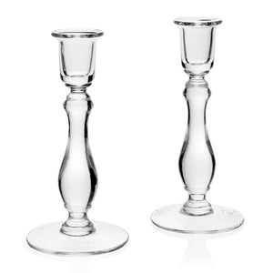 The Meryl Candlesticks Pair, 8” by William Yeoward Crystal features handmade glass holders with round bases and elegant curves, showcased against a white background to emphasize their timeless design.