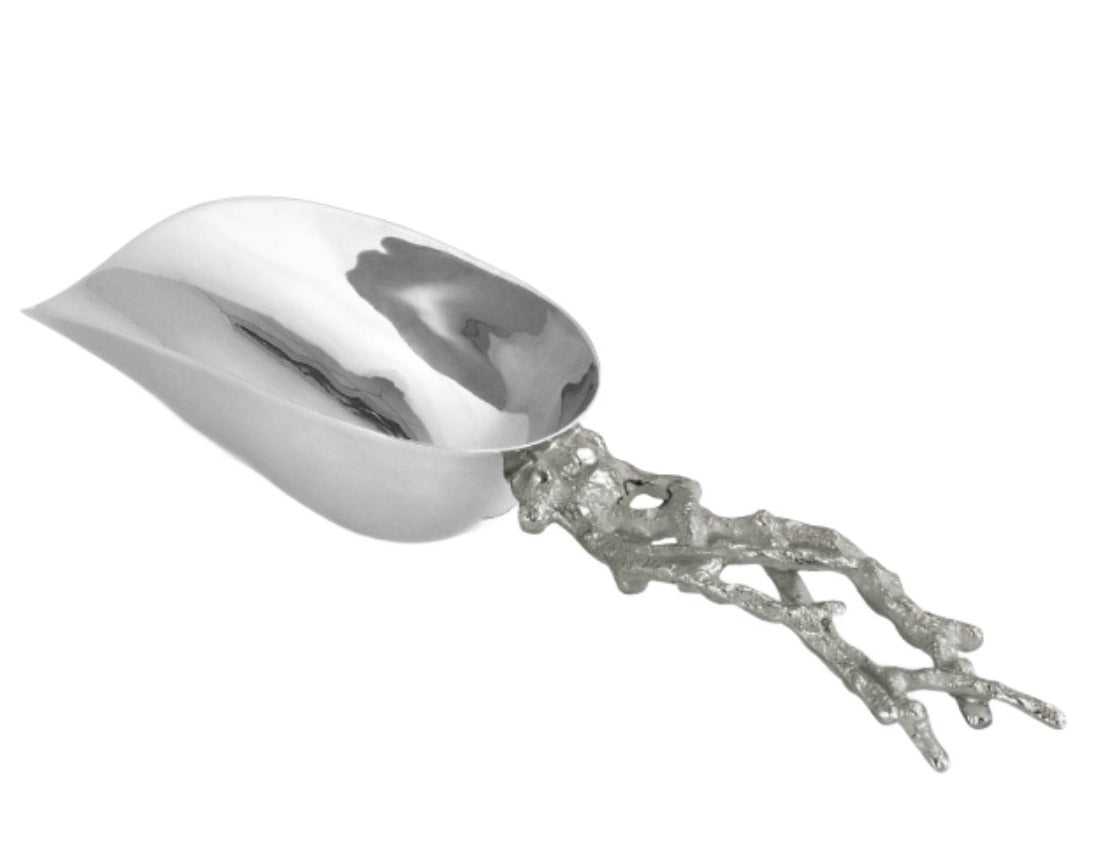 The Michael Aram Ocean Reef Ice Scoop features a polished stainless steel bowl and an irregular, coral reef-inspired textured handle.