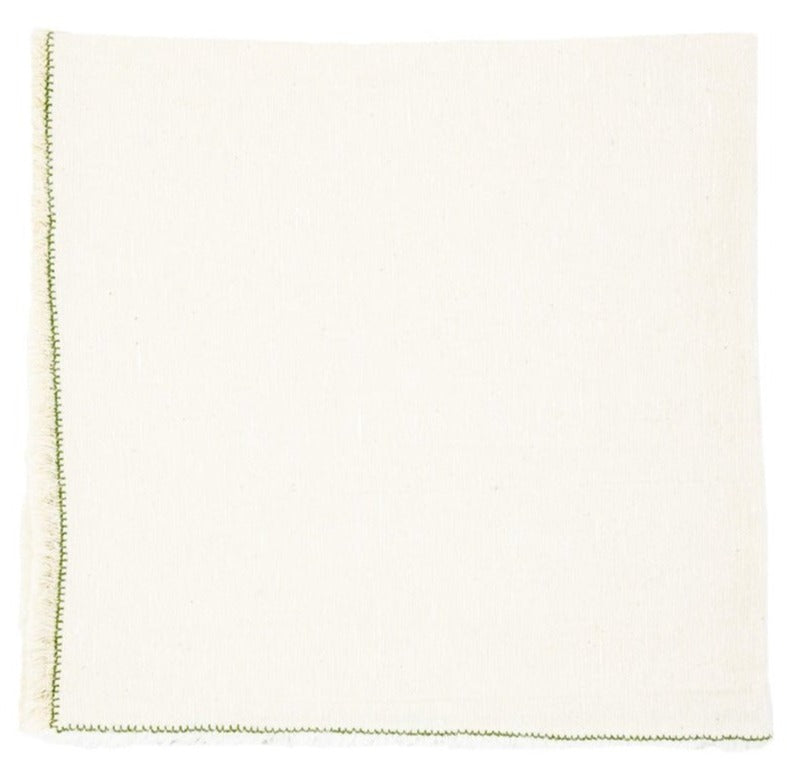 The Nomad Stitch Fringe Napkin Set by Deborah Rhodes features plain white cloth with green stitching on two edges, shown flat on a white background. Ideal for pairing with braided placemats and vibrant table settings.