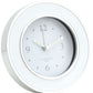 The Round Alarm Clock by Addison Ross features a light gray face, minimalistic numerals, and an enamel frame, showing the time as 12:16 and adding a touch of elegance to any space.