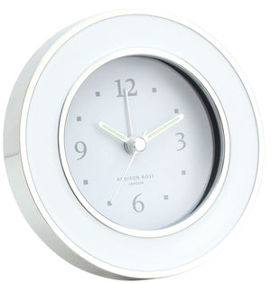 The Round Silver Alarm Clock by Addison Ross features black hour and minute hands on a gray face, displays 10:09:37, and is ideal for any bedside table.