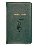 The "On the Green Score Book" by Graphic Image is a green leather-bound book, featuring an embossed golfer silhouette. It's a perfect gift for golfers, offering meticulous score-keeping while adding sophistication to your golfing essentials.