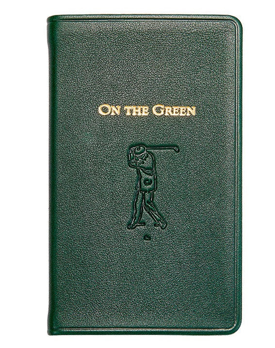 The "On the Green Score Book" by Graphic Image is a green leather-bound book, featuring an embossed golfer silhouette. It's a perfect gift for golfers, offering meticulous score-keeping while adding sophistication to your golfing essentials.