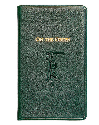 The "On the Green Score Book" by Graphic Image is a green leather-bound book, featuring an embossed golfer silhouette. It's a perfect gift for golfers, offering meticulous score-keeping while adding sophistication to your golfing essentials.