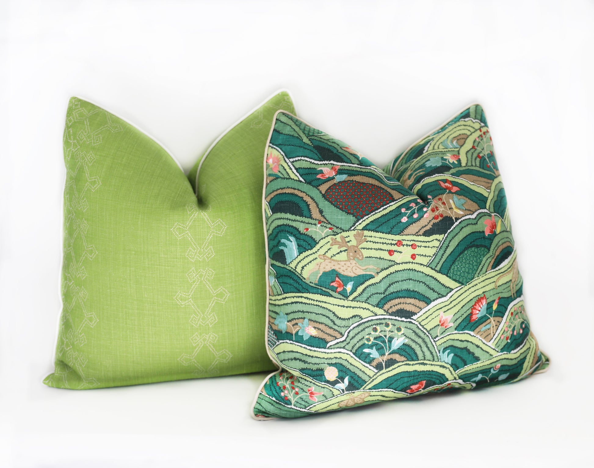 Two green Edgar Custom Drapery Rolling Hills Pillows on a white background.