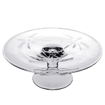 The William Yeoward Crystal Palmyra Serving Platter is a clear glass piece with etched palm trees on the bowl and base, designed with a pedestal style, resembling a handmade goblet.