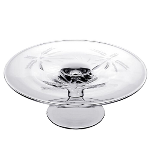The William Yeoward Crystal Palmyra Serving Platter is a clear glass piece with etched palm trees on the bowl and base, designed with a pedestal style, resembling a handmade goblet.