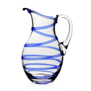 The Bella Pitcher by William Yeoward Crystal is a handmade glass pitcher with a handle, featuring diagonal blue swirl stripes—ideal for serving long drinks. Displayed on a plain white background.