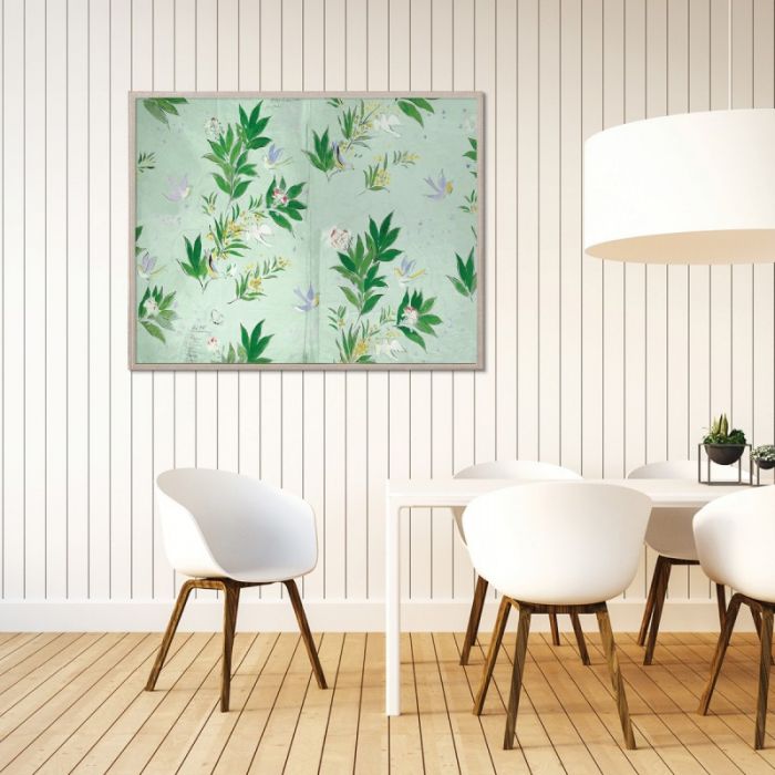 A modern dining area with white chairs, a white table, wood flooring, and Doves by Paule Marrot in Acrylic Box from Natural Curiosities displayed on a white vertical paneled wall.