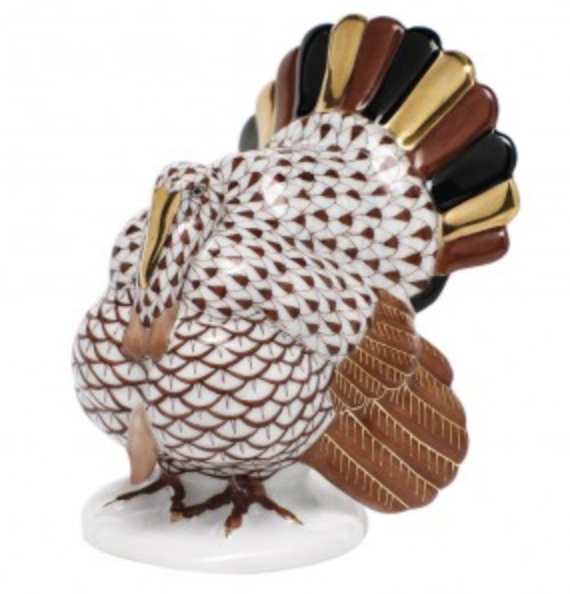 The Herend Tom Turkey Collection features a handmade porcelain figurine of a turkey with brown, black, and 24K gold painted accents, standing on a white base.