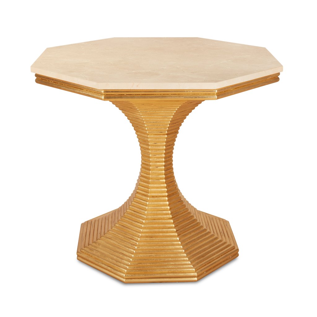 The Hourglass Table in Gold Patina by Bunny Williams features a beige octagonal top with an antique gold textured pedestal base and a hexagonal platform, exuding timeless charm.